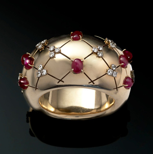 A cabochon ruby and diamond bangle attributed to Paul Flato, USA, 1940s, formerly owned by the Art Deco painter Tamara de Lempicka, which is priced at £47,000 ($74,620) on the stand of Twenty-First Century Jewels at the LAPADA Berkeley Square Art & Antiques Fair. Image courtesy Twenty-First Century Jewels and LAPADA.